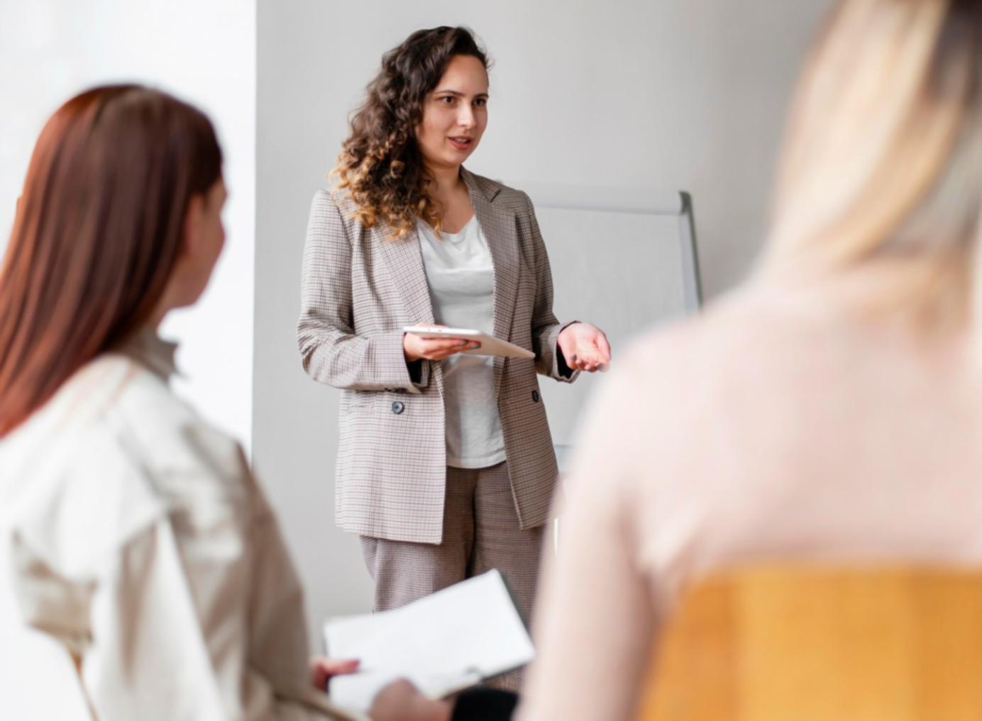 Instructor explaining algorithm complexity analysis on whiteboard during WaveMax session